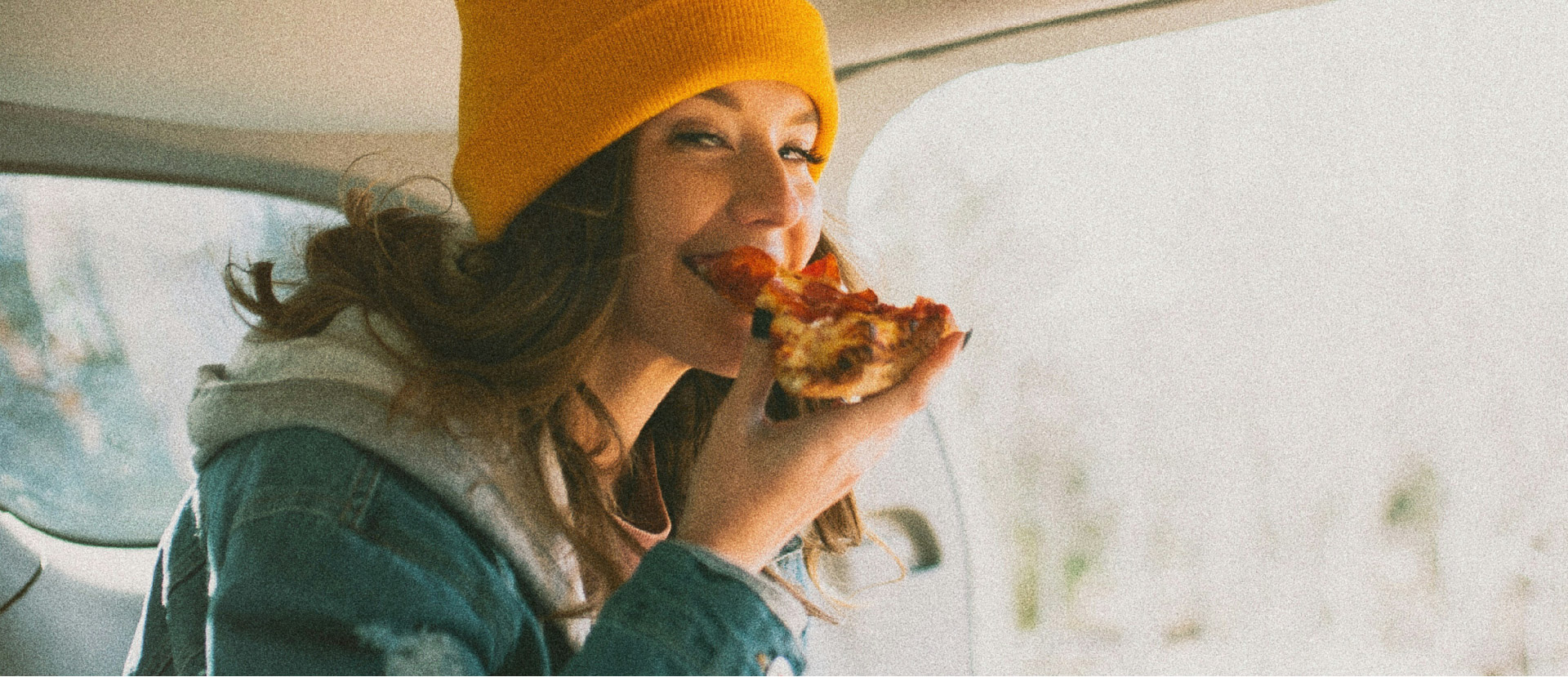 woman eating in a car